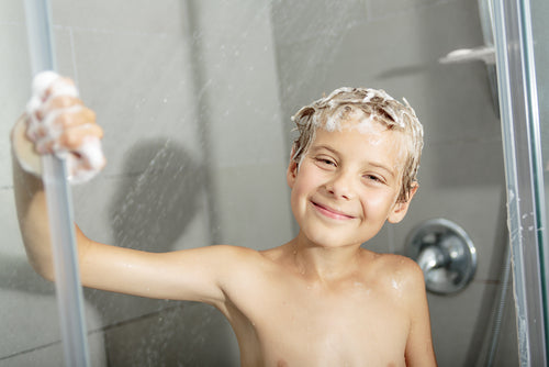 boy with rich soap lather — soft water results from MiniMax water softener